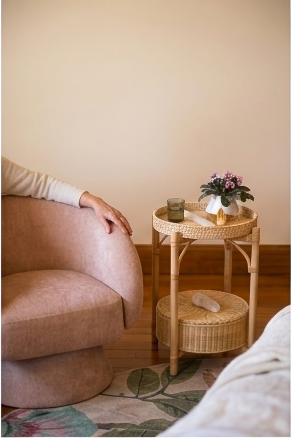 Frederica Dillon seated in the treatment space at Terra Lume, Eaglehawk Neck — Reiki practitioner and Biofield Tuning student.